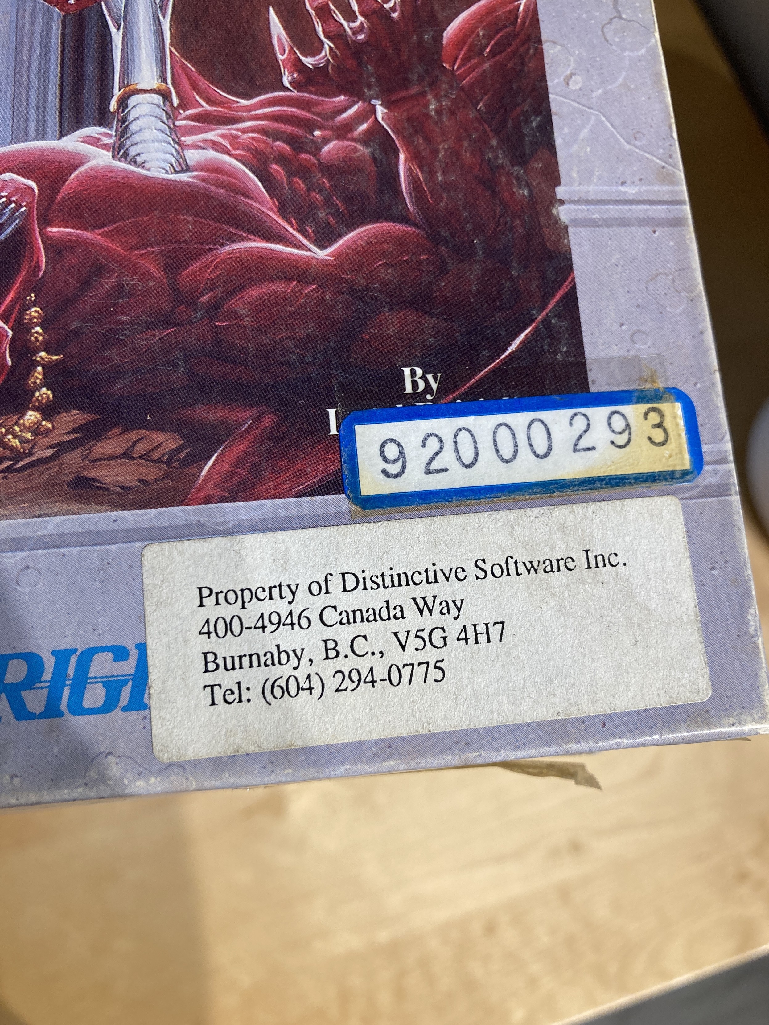 A Property of Distinctive Software label, stuck on the corner of the Ultima VI box.

It is given a serial number for its library.