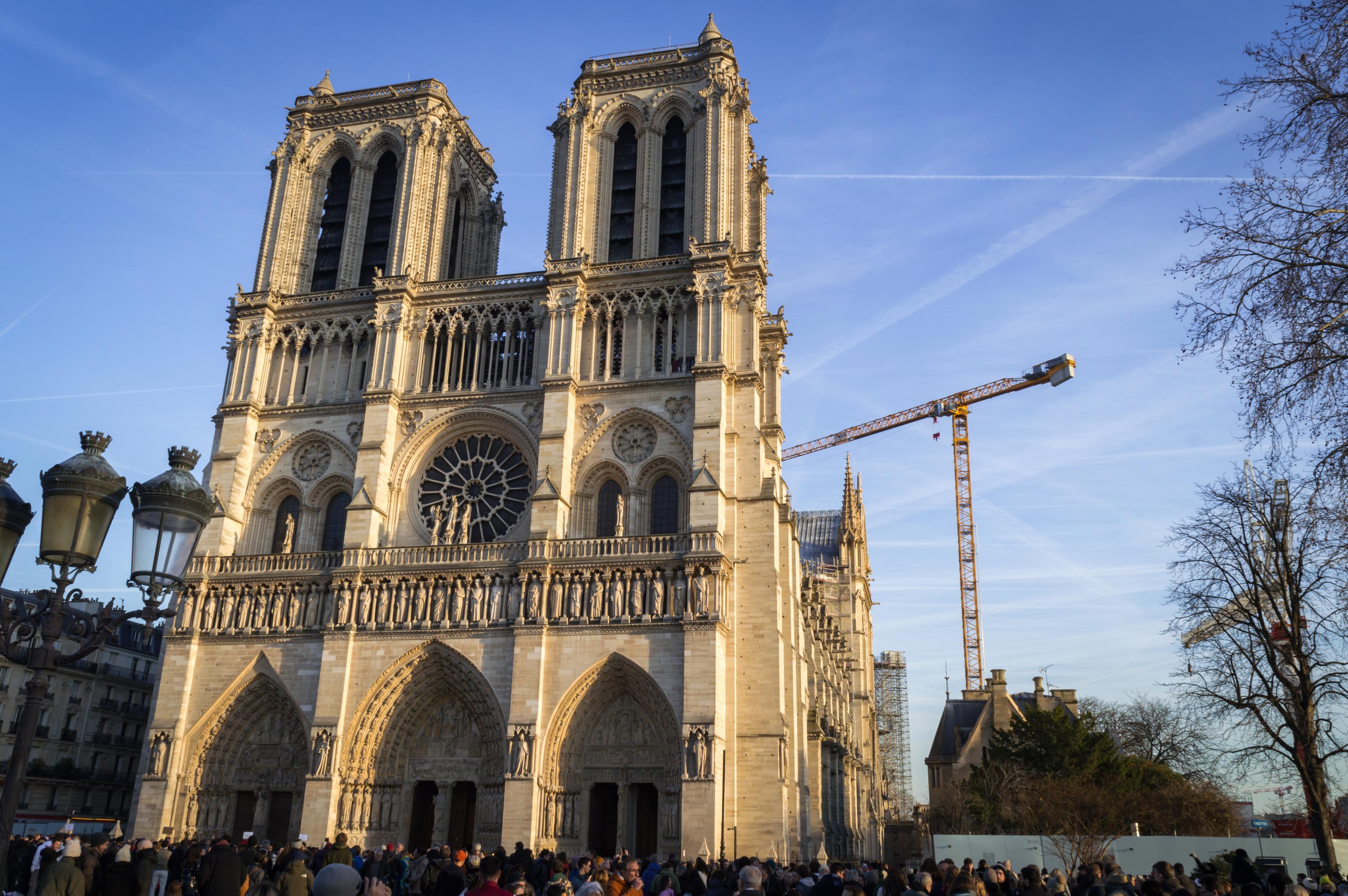 Notre Dame from some distance, there's a big crowd in front of it