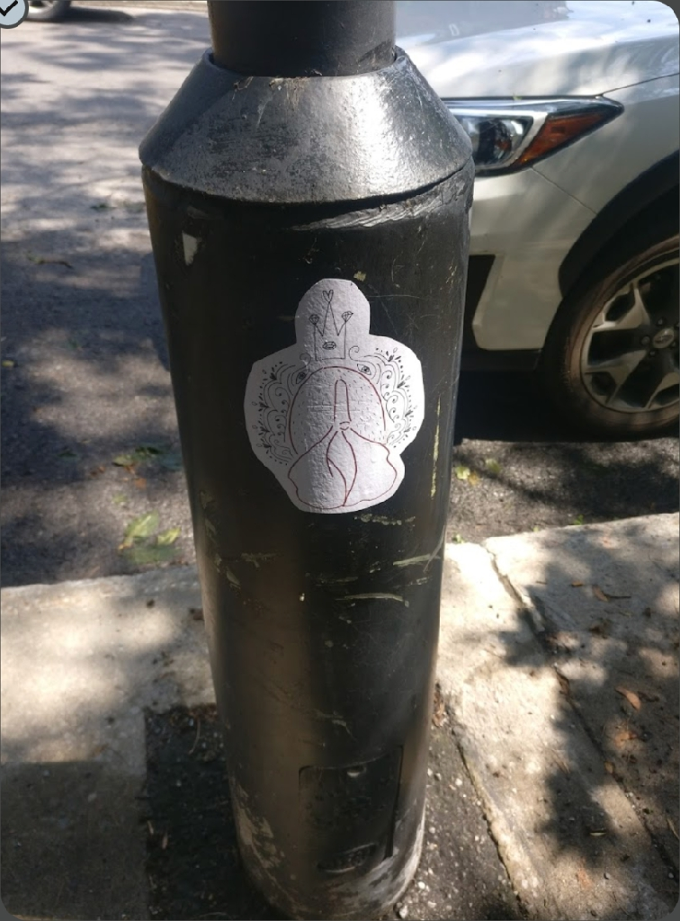 vulva sticker on lamp post 