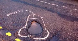 Manchester man draws penises around potholes so the city will fix them