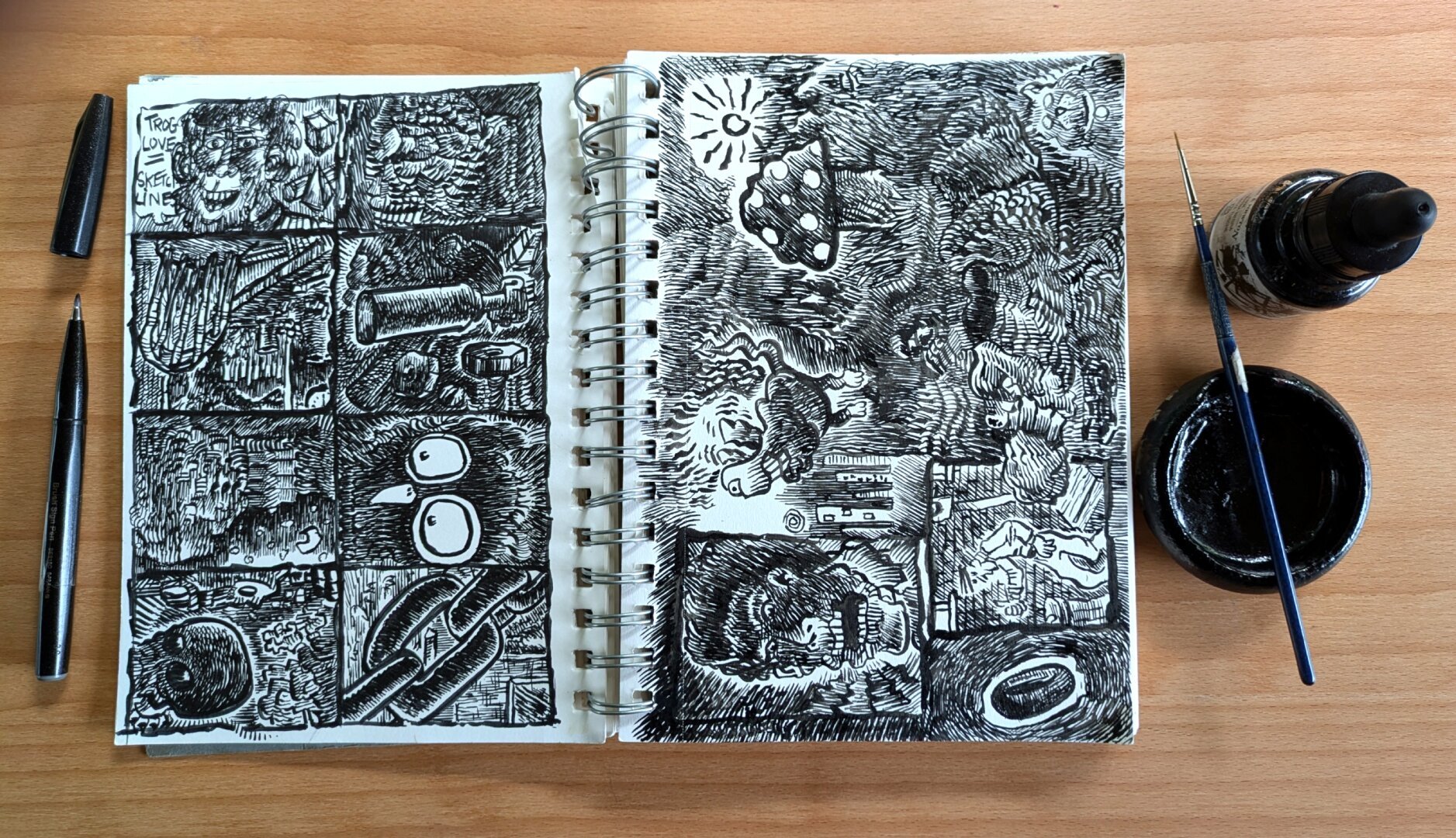 Sketchbook with two pages of doodles in ink.