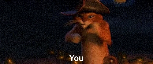 a gif of puss in boots saying "you"