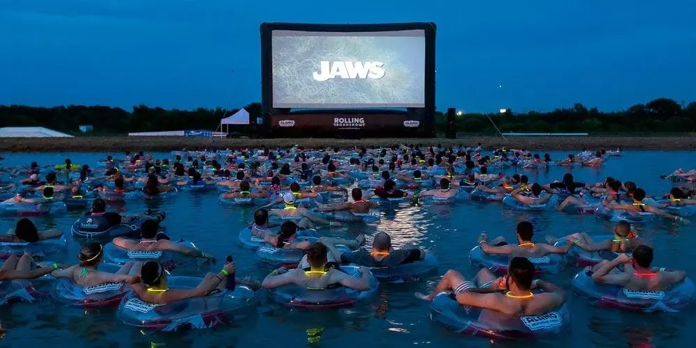 People watching Jaws while sitting in an inner tube In Lake Travis, Texas