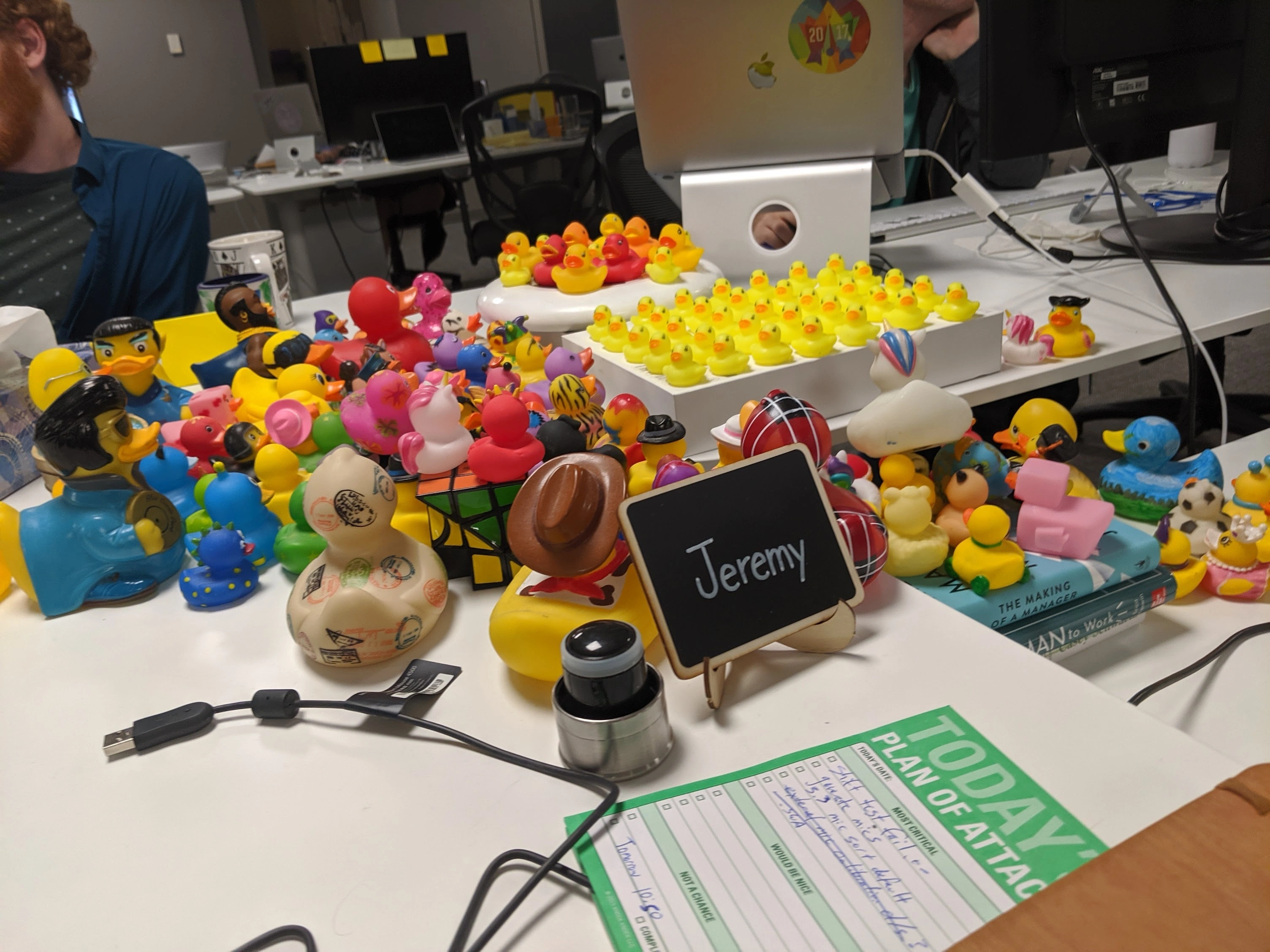 many many ducks on office desks